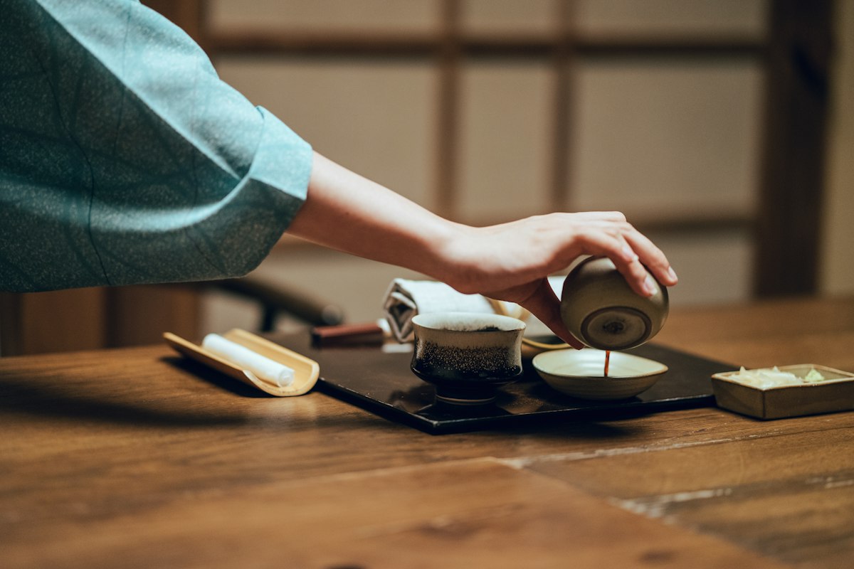 Master tea craftsman preparing equipment